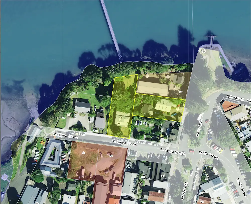 Aerial view of a site layout in Raglan Whāingaroa, showing property boundaries in yellow overlaid on a coastal landscape.